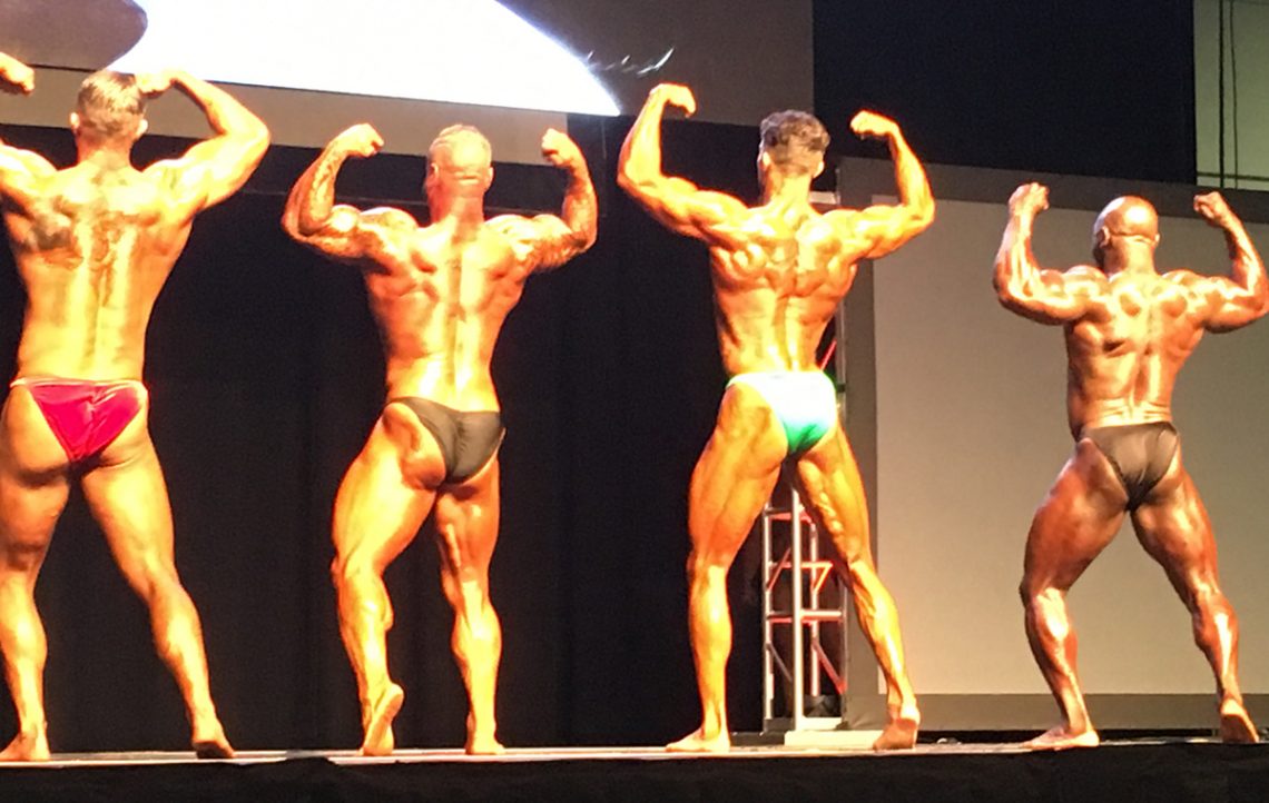 Seena Khonsari on Stage - Backs / Lats - Personal Trainer & 1st Place Heavyweight - Gold Medal Bodybuilding & Coach